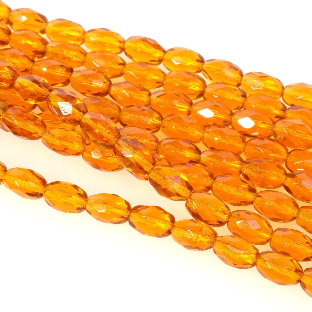 Fil de perles de Bohème Olives facettées 9x6mm orange miel transparent