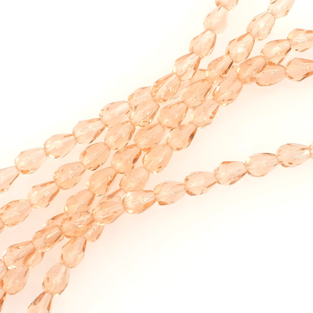 Fil de perles de Bohème gouttes 7x5mm rose pêche transparent